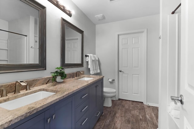 5242 E Dolphin St, North Charleston, SC 29405 - full bath featuring double vanity, wood finished floors, and a shower