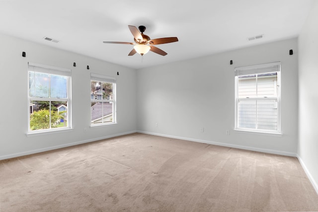 5242 E Dolphin St, North Charleston, SC 29405 - empty room with light carpet and a ceiling fan