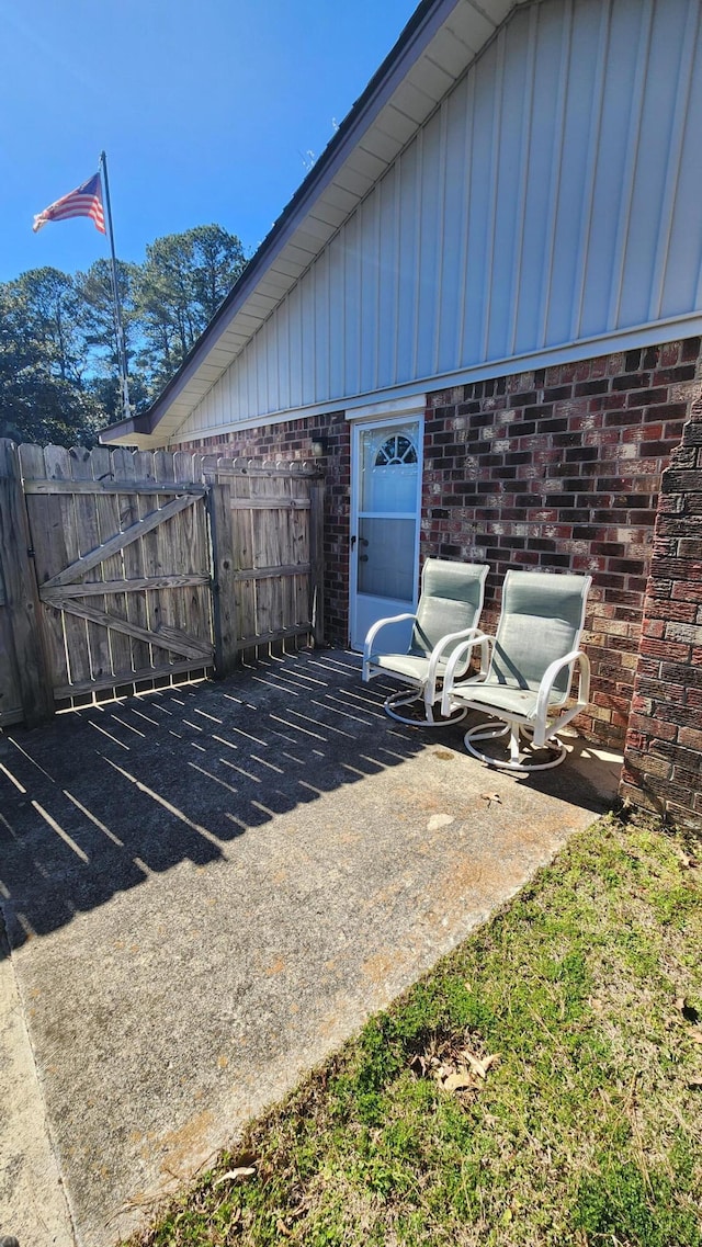 view of patio / terrace featuring fence