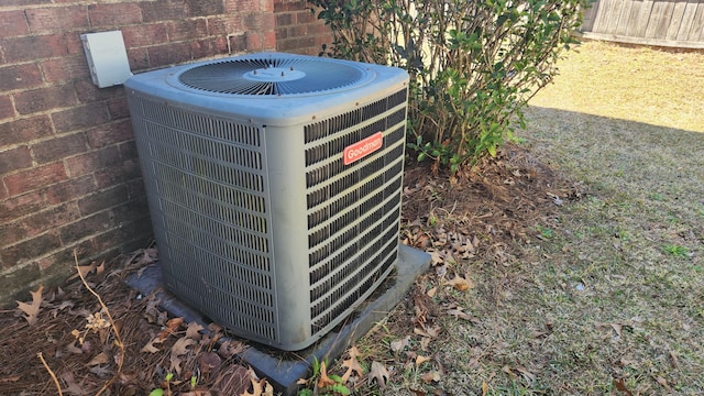 exterior details with brick siding and central AC unit