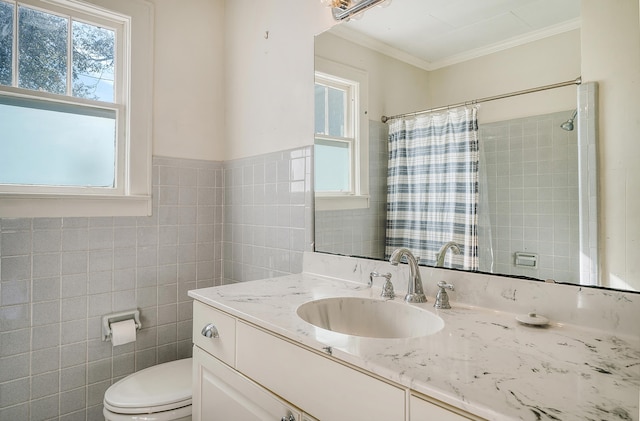 bathroom featuring tile walls, vanity, toilet, and crown molding