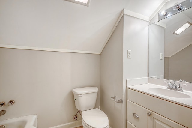 bathroom with vanity, toilet, and lofted ceiling