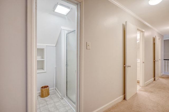 hallway with light carpet and crown molding