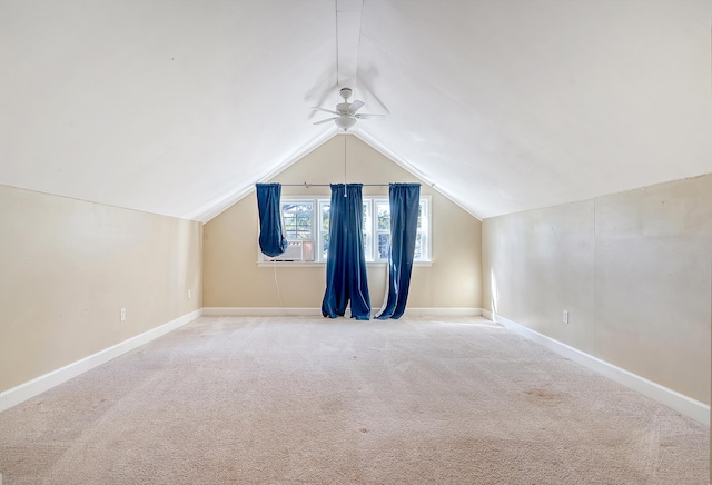 additional living space with carpet floors, lofted ceiling, and ceiling fan