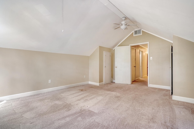 bonus room featuring ceiling fan, light colored carpet, and lofted ceiling