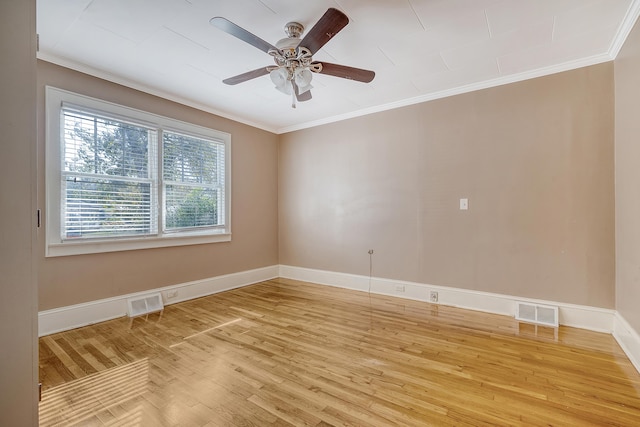 unfurnished room with ornamental molding, hardwood / wood-style floors, and ceiling fan