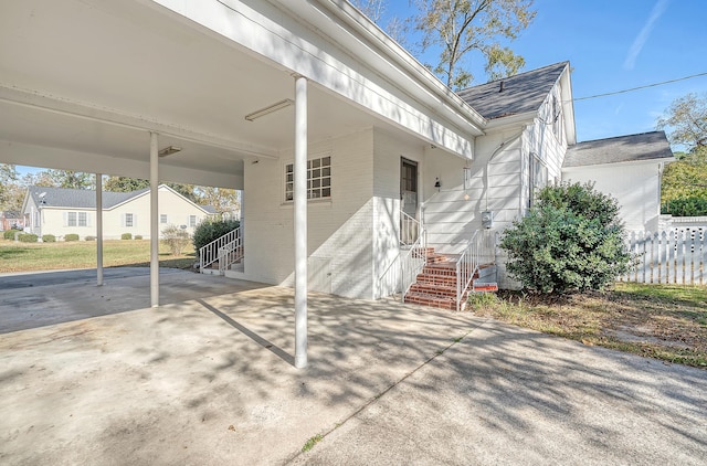 exterior space with a carport