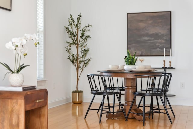 dining area featuring light wood-type flooring