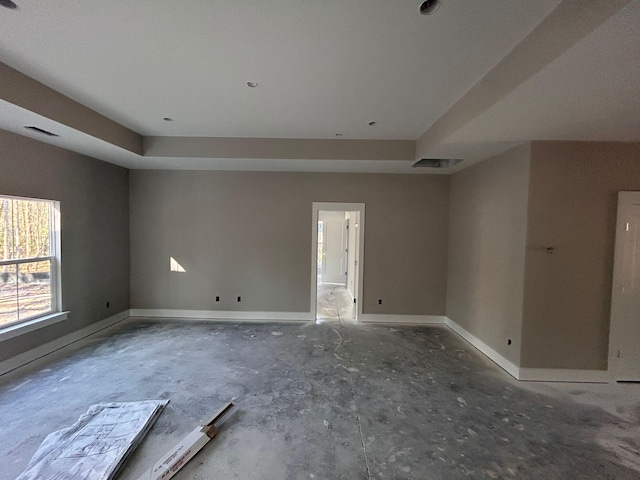 empty room with visible vents and baseboards