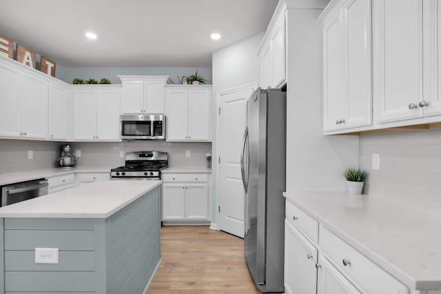 204 Honey Horn Dr, Summerville, SC 29486 - kitchen featuring light wood-style flooring, white cabinets, and stainless steel appliances