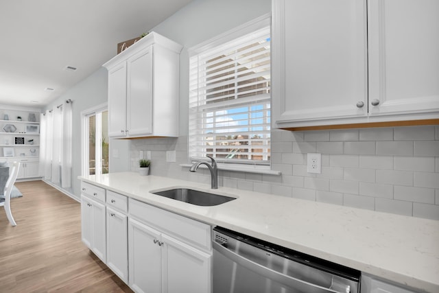 204 Honey Horn Dr, Summerville, SC 29486 - kitchen featuring tasteful backsplash, white cabinetry, light wood-style floors, stainless steel dishwasher, and a sink