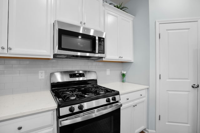 204 Honey Horn Dr, Summerville, SC 29486 - kitchen featuring appliances with stainless steel finishes, light stone counters, backsplash, and white cabinets