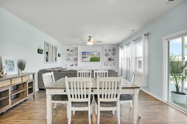 204 Honey Horn Dr, Summerville, SC 29486 - dining room featuring visible vents, baseboards, built in shelves, a ceiling fan, and light wood-style flooring