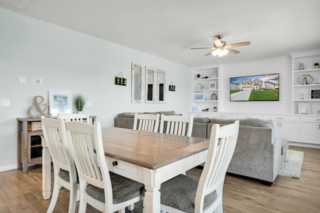 204 Honey Horn Dr, Summerville, SC 29486 - dining space with light wood-style floors, built in features, baseboards, and a ceiling fan