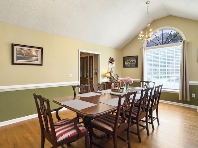 5505 Indigo Makers Trce, Charleston, SC 29418 - dining area featuring an inviting chandelier, light wood-style flooring, baseboards, and vaulted ceiling