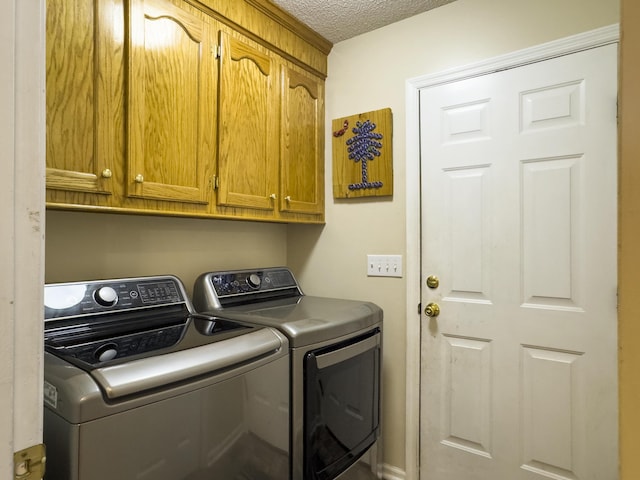 5505 Indigo Makers Trce, Charleston, SC 29418 - laundry area with cabinet space, a textured ceiling, and washer and clothes dryer