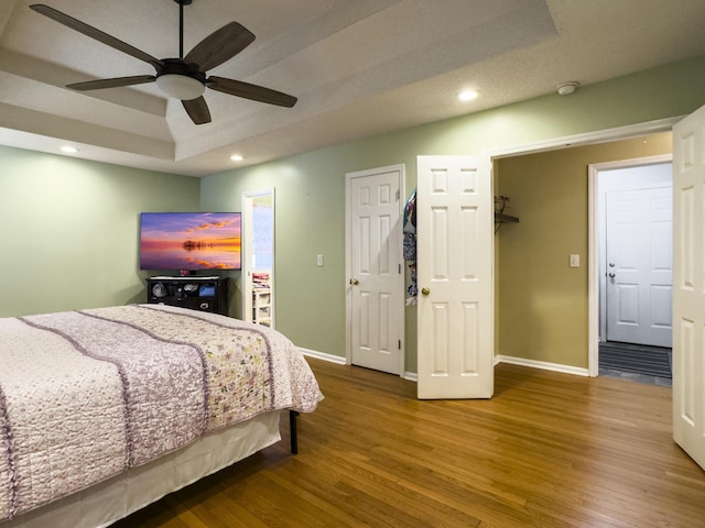 5505 Indigo Makers Trce, Charleston, SC 29418 - bedroom featuring recessed lighting, baseboards, wood finished floors, and a tray ceiling