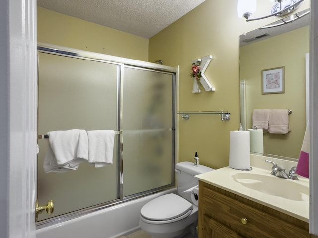 5505 Indigo Makers Trce, Charleston, SC 29418 - bathroom with vanity, toilet, a textured ceiling, combined bath / shower with glass door, and visible vents