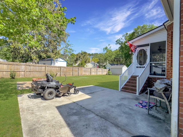 5505 Indigo Makers Trce, Charleston, SC 29418 - view of patio featuring a sunroom and a fenced backyard