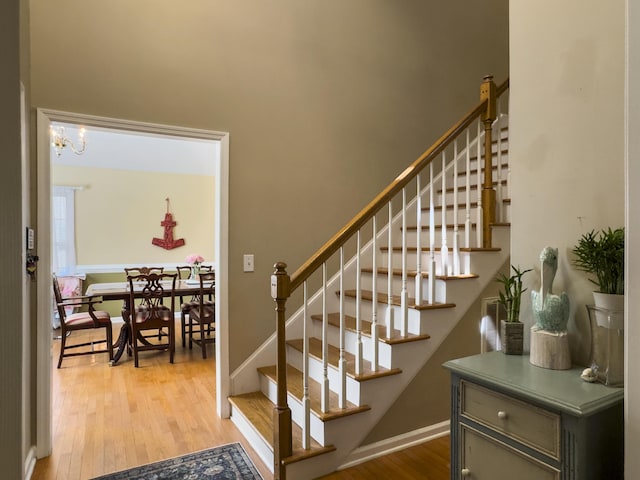 5505 Indigo Makers Trce, Charleston, SC 29418 - staircase featuring wood finished floors and a chandelier