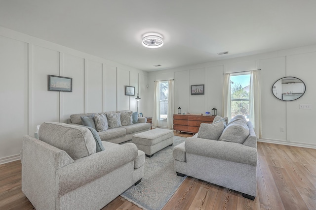 living room with light hardwood / wood-style floors