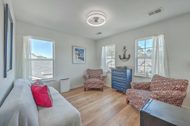 living area with light hardwood / wood-style floors