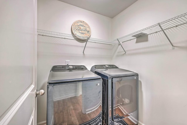 washroom with washer and clothes dryer