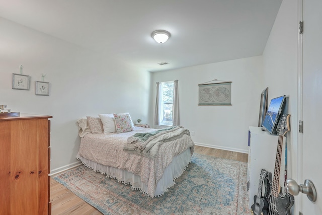 bedroom with light hardwood / wood-style flooring