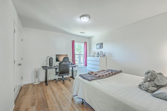 bedroom with light hardwood / wood-style floors