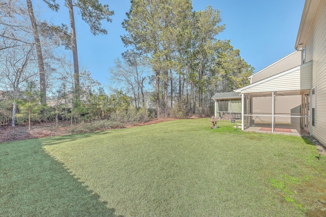 view of yard with a sunroom