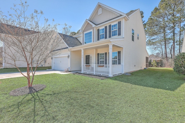 view of front of house featuring a front lawn, a garage, and a porch