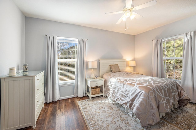 bedroom featuring ceiling fan and dark hardwood / wood-style flooring