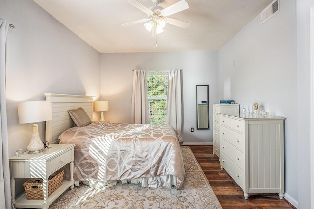 bedroom featuring ceiling fan and dark wood-type flooring