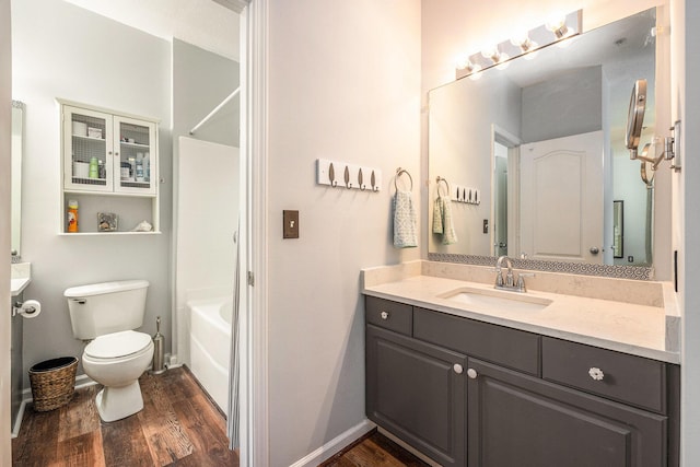 full bathroom with vanity, shower / bathtub combination, toilet, and wood-type flooring