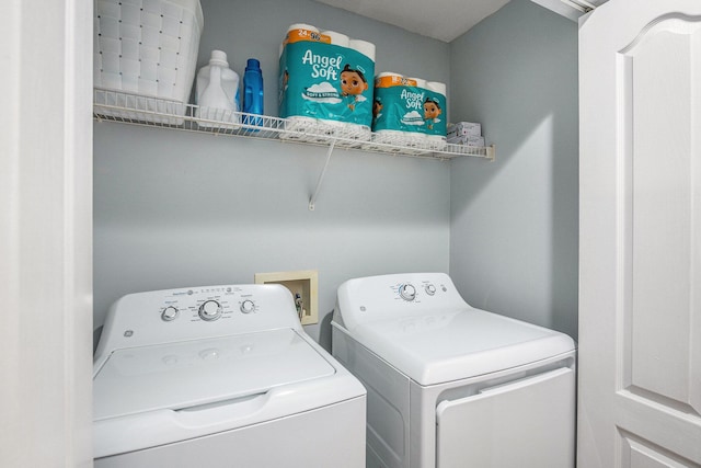 clothes washing area featuring separate washer and dryer