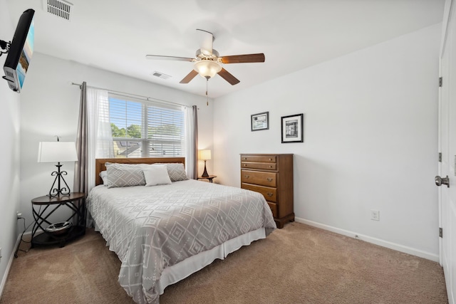 bedroom featuring carpet, baseboards, and a ceiling fan