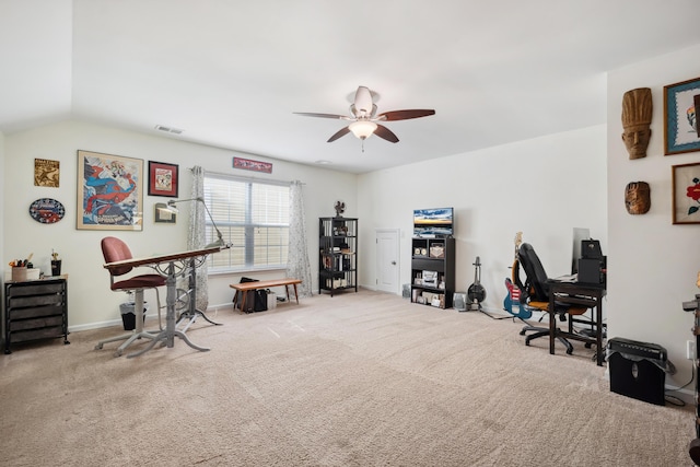 carpeted home office with ceiling fan, baseboards, and lofted ceiling