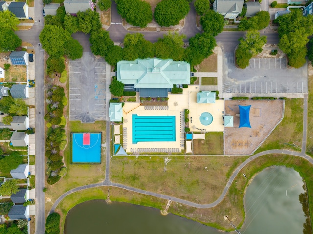 aerial perspective of suburban area featuring a pool area