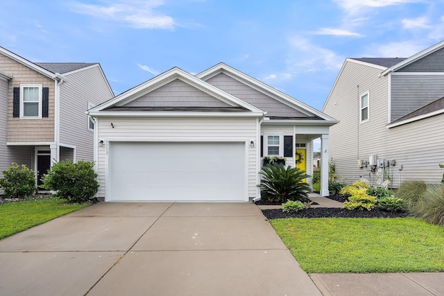 9712 Fanning Basket Ln, Ladson, SC 29456 - view of front facade featuring driveway, a garage, and a front lawn