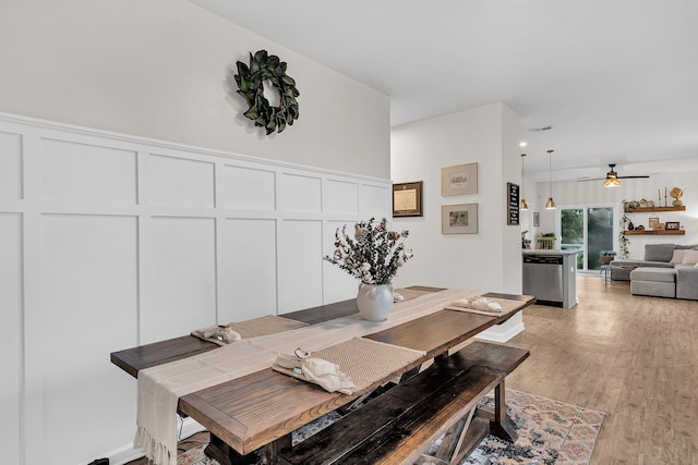 9712 Fanning Basket Ln, Ladson, SC 29456 - dining space with a decorative wall, light wood-type flooring, and ceiling fan