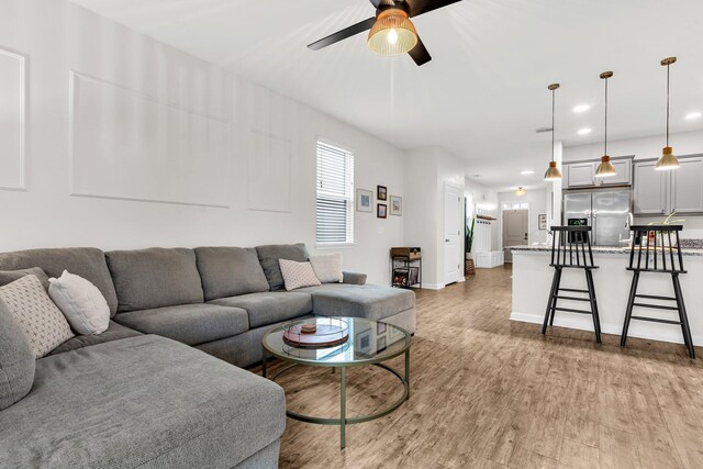 9712 Fanning Basket Ln, Ladson, SC 29456 - living area featuring a ceiling fan, light wood-type flooring, baseboards, and recessed lighting