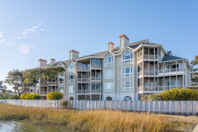 view of building exterior featuring a water view