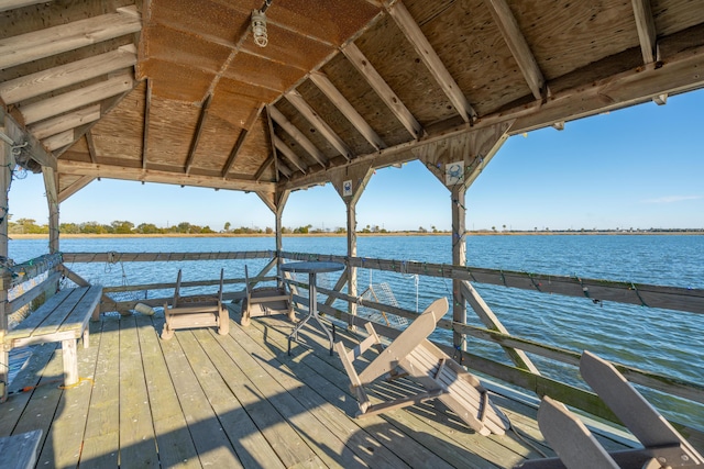 view of dock featuring a gazebo and a water view