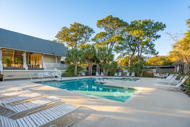 view of swimming pool featuring a patio area