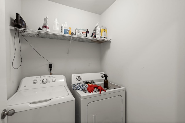 clothes washing area with laundry area and independent washer and dryer
