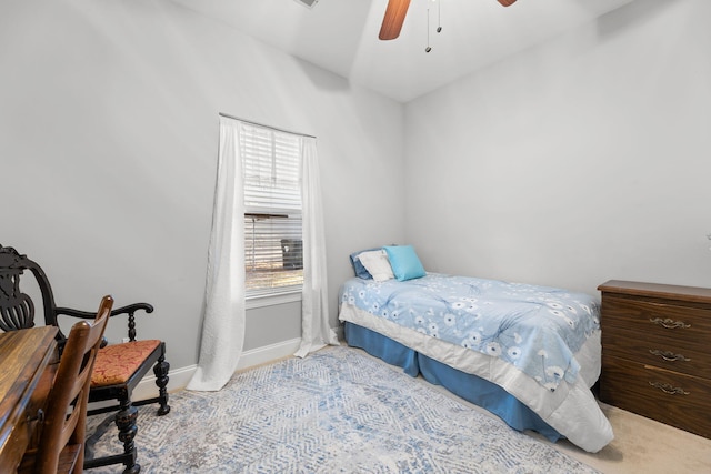 bedroom with ceiling fan and light colored carpet