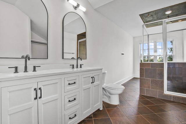 full bathroom featuring an enclosed shower, a sink, double vanity, and toilet