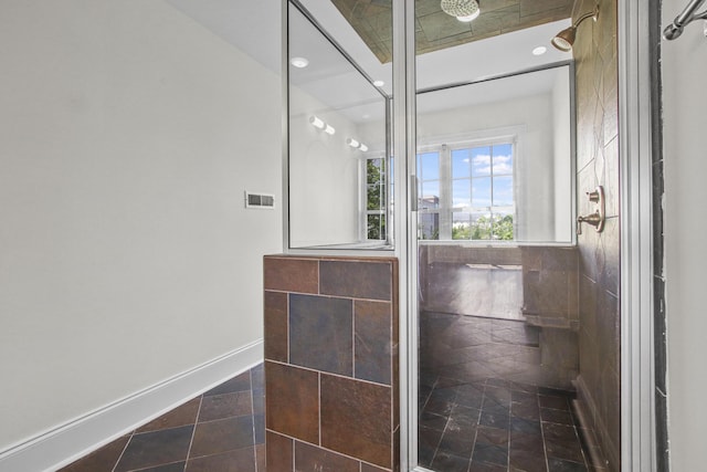 bathroom featuring tile patterned flooring, baseboards, and recessed lighting