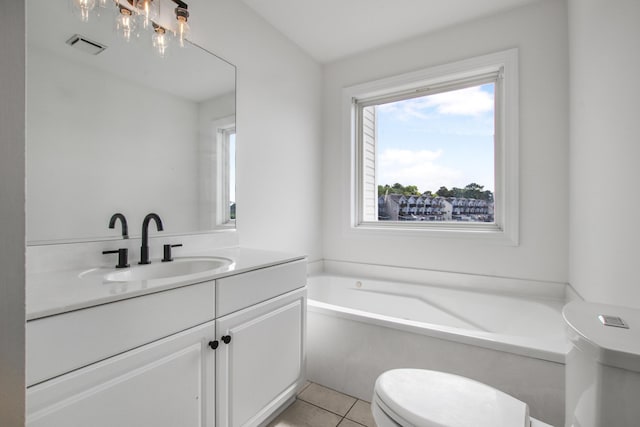 bathroom with tile patterned flooring, visible vents, toilet, vanity, and a garden tub