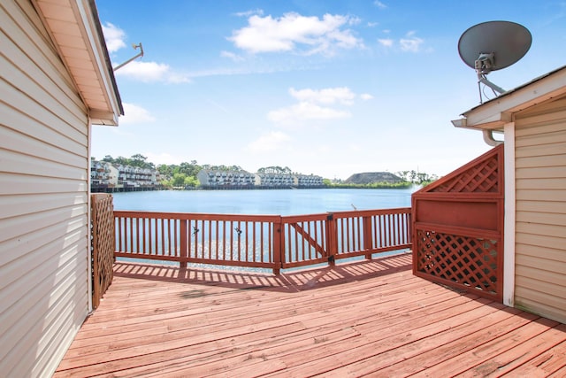 wooden terrace with a water view